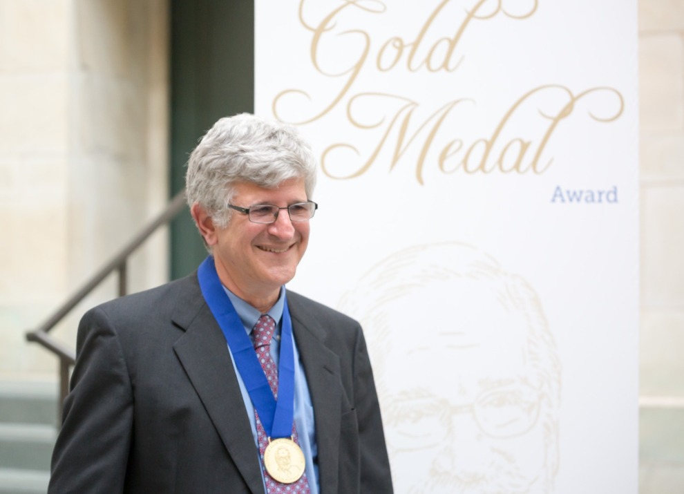 Dr. Paul Offit standing with the Gold Medal