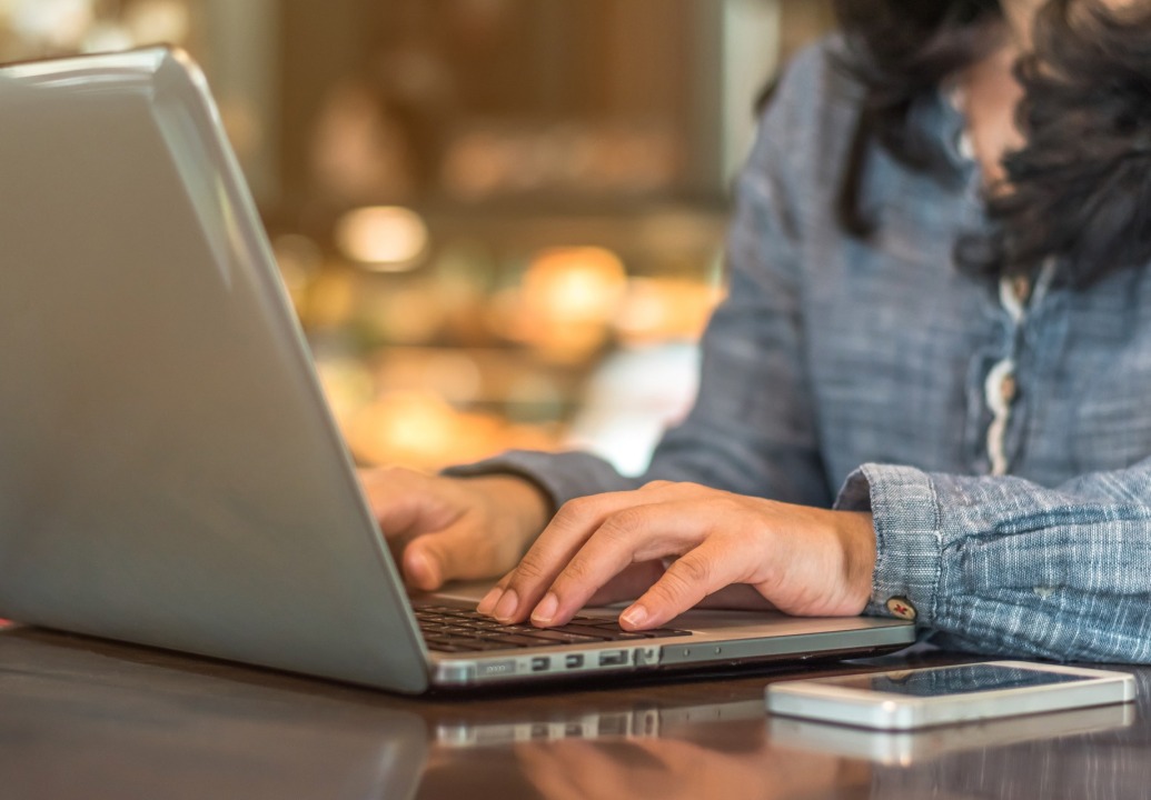 Close-up of woman typing