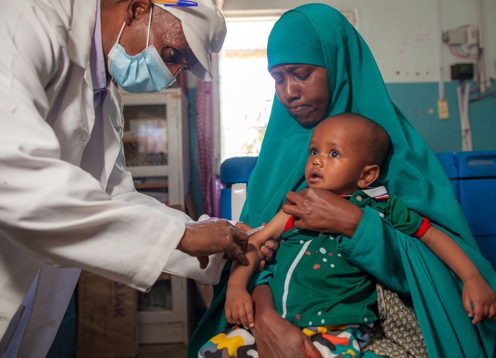 A child is vaccinated against measles at the United Kingdom and UNICEF-supported Nutrition Health Centre in Hargeisa, Somalia, 2021