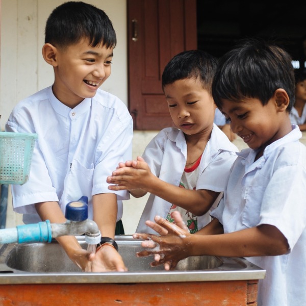Children washing their hands